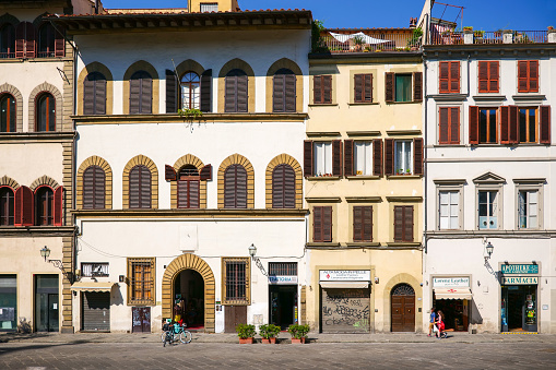 Florence, Italy, August 12 -- The palaces on the square of the Basilica of San Lorenzo in the iconic heart of Florence, near the Central Market. For three hundred years, starting from the fourth century, San Lorenzo was the cathedral of the city. Image in High Definition format.