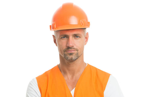 istock man in helmet. wear construction helmet on building site. Builders dressed in protective vest and helmet. Construction worker isolated on white. skilled technician in safety helmet. social work 1268642804