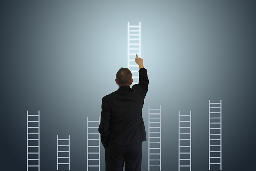 Businessman leadership ladder of success business competition