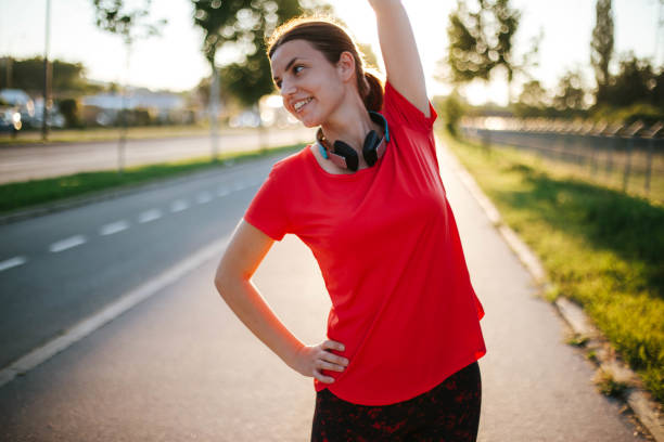 istock Young woman doing exercise outdoor 1268647957