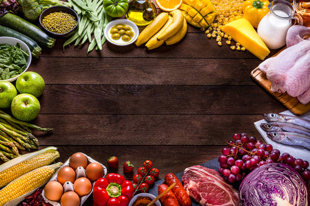 istock Various kinds of food types arranged in a rainbow gradient frame with copy space 1268650595