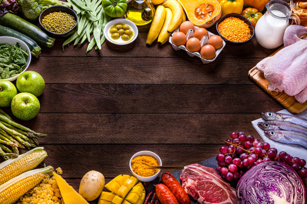 istock Various kinds of food types arranged in a rainbow gradient frame with copy space 1268650602