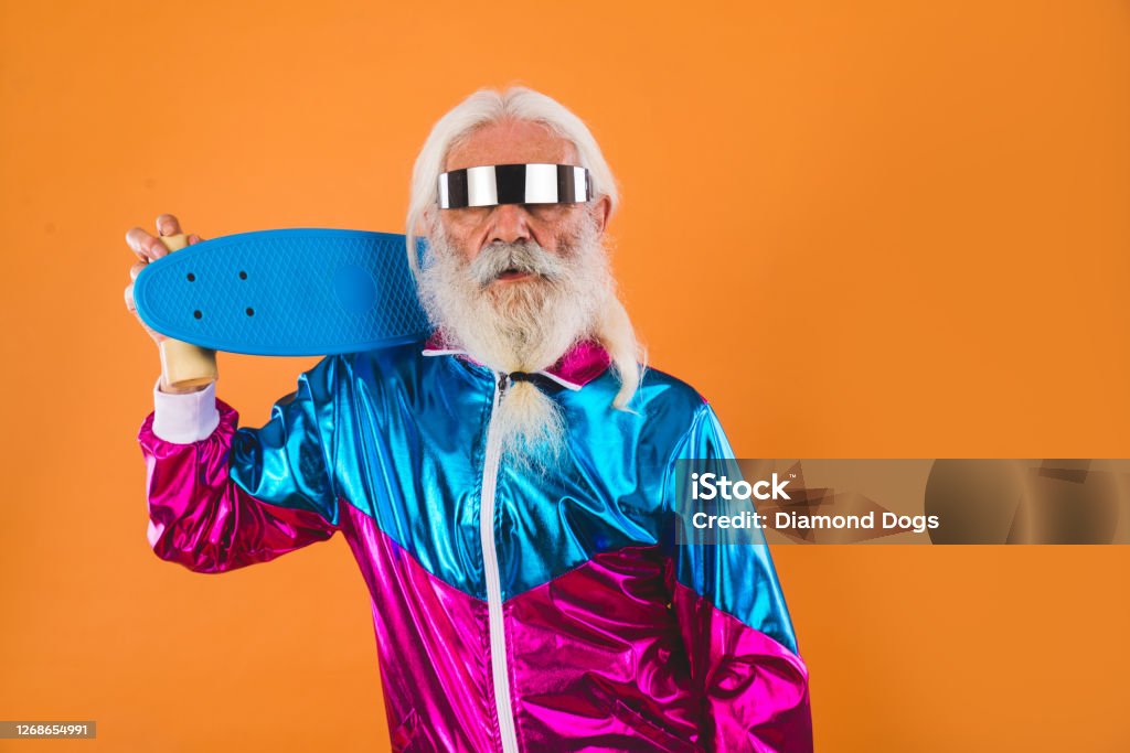 Stylish senior man portrait Senior man with eccentric look  - 60 years old man having fun, portrait on colored background, concepts about youthful senior people and lifestyle Bizarre Stock Photo