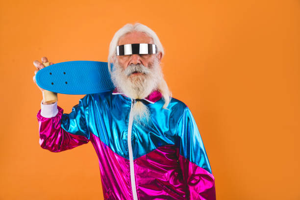 Stylish senior man portrait Senior man with eccentric look  - 60 years old man having fun, portrait on colored background, concepts about youthful senior people and lifestyle active seniors photos stock pictures, royalty-free photos & images