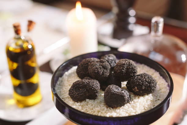 istock Black truffle mushroom on the rice Black Truffles on the table. 1268655039