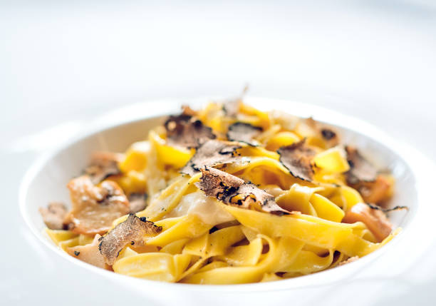 Pasta with truffles, typical autumn dish.Restaurant menu dish