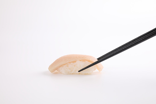 Hamachi sushi , Japanese food yellowtail sushi with chopsticks isolated in white background