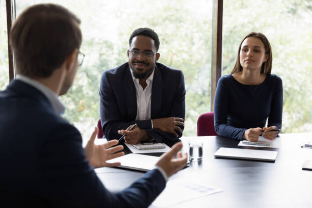 istock Diverse colleagues receiving good offer from business partner 1268659485