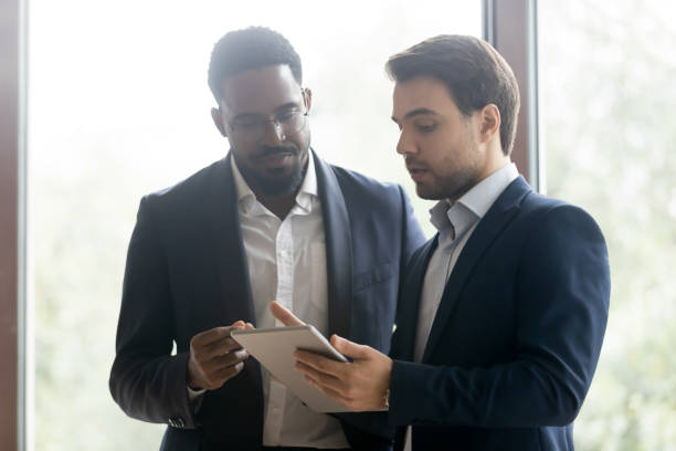 istock Caucasian manager offer a deal to african client 1268659529