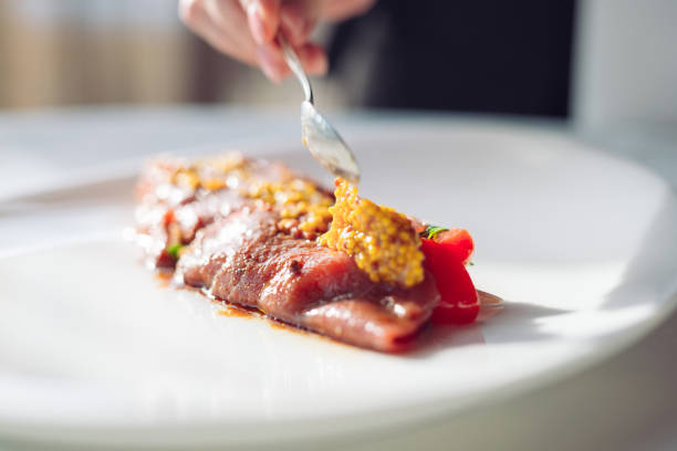 istock The Dish Is Carpaccio. Chef dung grainy mustard dish, Carpaccio 1268661240