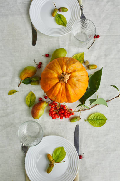 istock Thanksgiving Day or Halloween dinner table place setting 1268661450