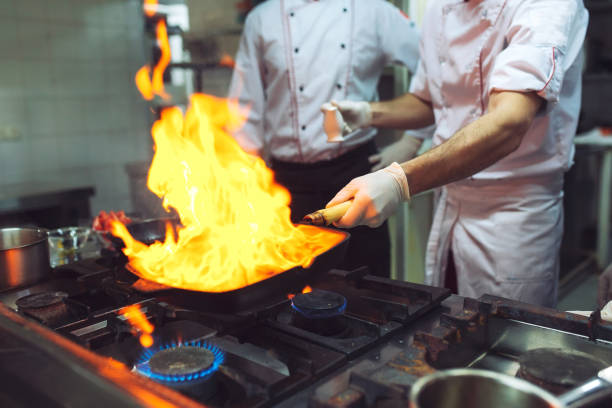 istock Fire in the kitchen. Fire gas burn is cooking on iron pan,stir fire very hot 1268661453