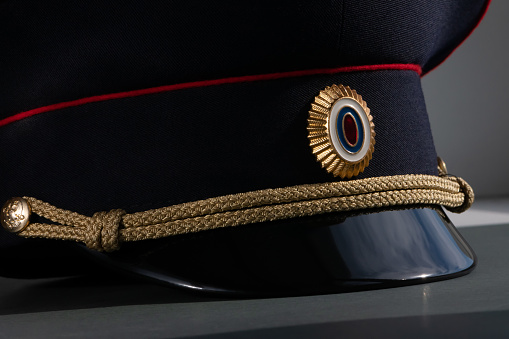 The headdress of a Russian police officer lies on the table, close-up in a low key. Police cap of the Russian Federation.