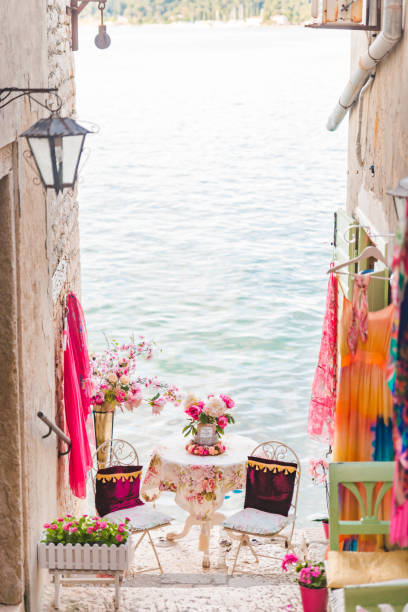 istock sweet cozy place table at the edge if the beach between building 1268664979