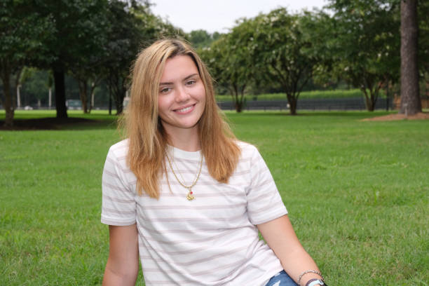 istock Teenage girl on school grounds. 1268665868