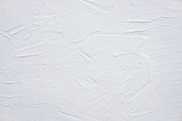 White textured wall. Decorative plaster close-up. White textured wall. Decorative plaster close-up. putty stock pictures, royalty-free photos & images