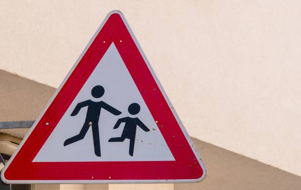 istock Sign Caution Children crossing Street Germany 1268668057