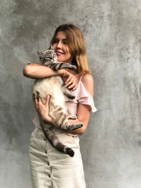 istock The girl is holding a cat. 1268669709