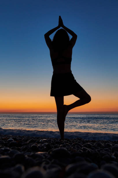 istock Woman meditating at morning time 1268670031