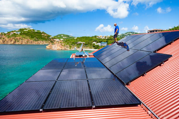 istock workers installing solar panels on a villa roof in the Caribbean 1268671802