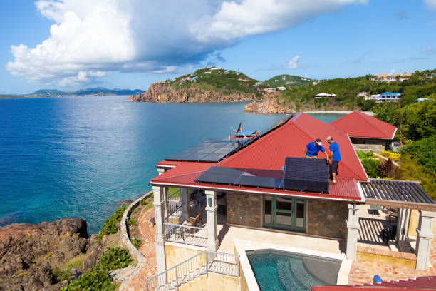 istock workers installing solar panels on a villa roof in the Caribbean 1268671806