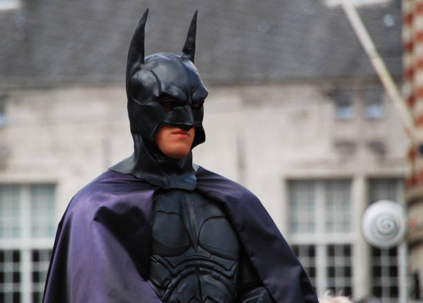 actor in batman costume in pose in central dam square - the dark knight imagens e fotografias de stock