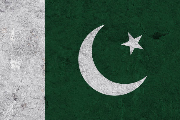 istock Flag of Pakistan on weathered concrete 1268679629