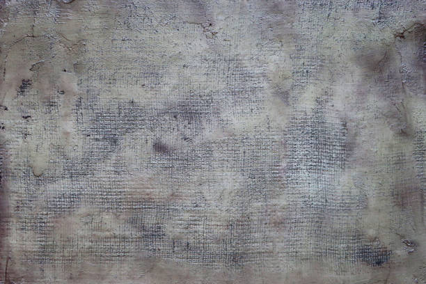 Stock photo showing a close-up elevated view of mottled, textured grey hessian background pattern with copy space.
