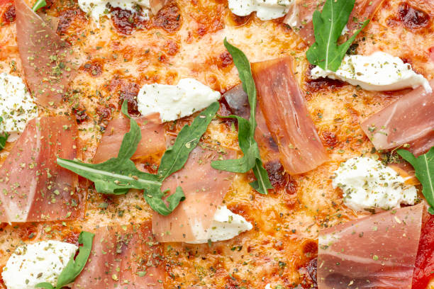 istock Pizza close-up. Background and made of pizza 1268681050