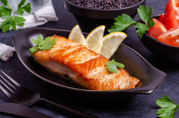 istock Roast salmon steak with unpolished rice 1268681347