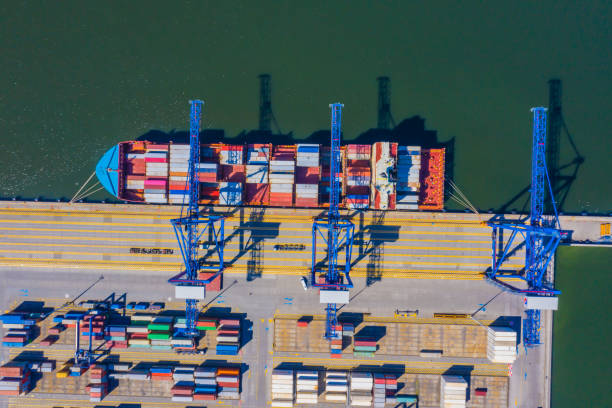 istock Container ship from sea port working for delivery containers shipment and container warehouse background. Suitable use for transport or import export to global logistics concept. 1268681414
