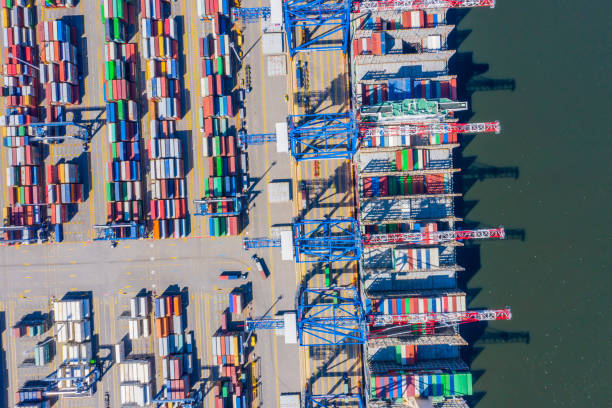 istock Container ship in export and import business and logistics. Shipping cargo to harbor by crane. Water transport International. Aerial view and top view. 1268681876