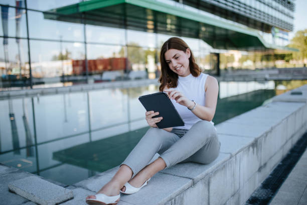 istock Young woman doing her work outdoor 1268682707