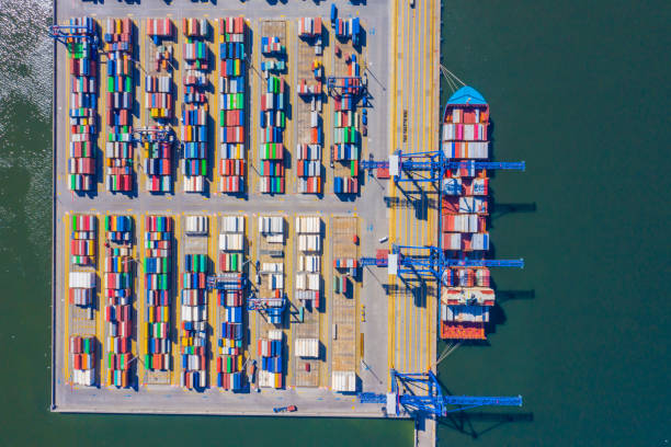 istock Container ship from sea port working for delivery containers shipment and container warehouse background. Suitable use for transport or import export to global logistics concept. 1268682992