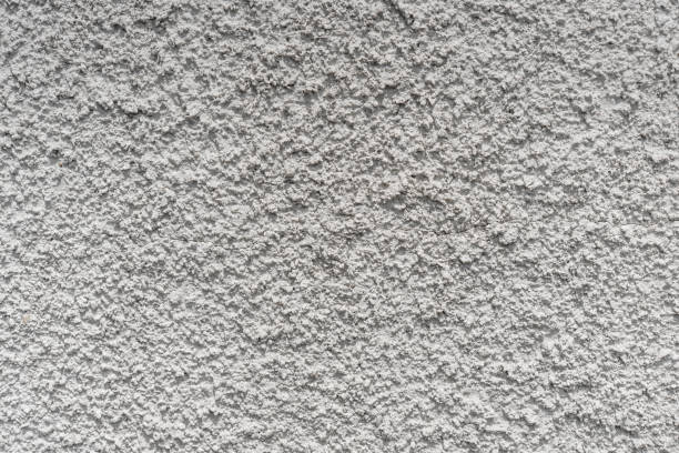 istock Gray cement wall. Gray concrete texture as background. Texture of gray concrete wall for background 1268684008