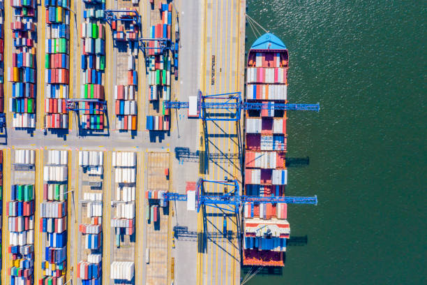 istock Aerial top view container cargo ship waiting for loading, import export business logistic and transportation by ship in open sea. 1268684155