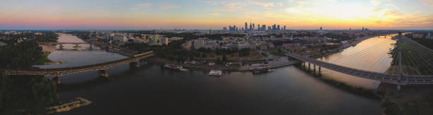 istock Panoramic view of large city with multiple bridges over river. Drone, aerial view 1268684511