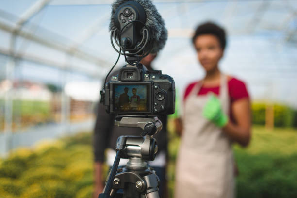 istock Two young African Americans vlogging in the greenhouse 1268685973