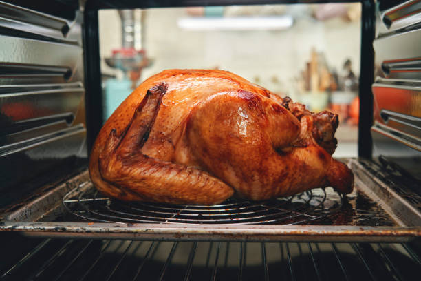 istock Roasting Turkey in the Oven for Holiday Dinner 1268686037