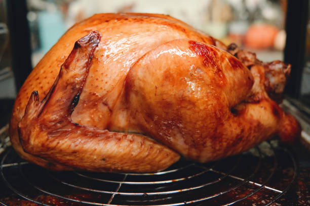 istock Roasting Turkey in the Oven for Holiday Dinner 1268686095