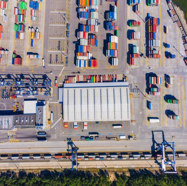 istock Container ship from sea port working for delivery containers shipment and container warehouse background. Suitable use for transport or import export to global logistics concept. 1268686300