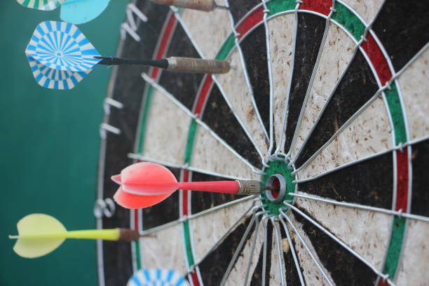 istock Darts target closeup. Success hitting target aim goal achievement concept 1268689834