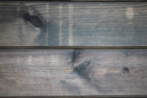istock Natural Wooden dark polished wall background texture 1268689841
