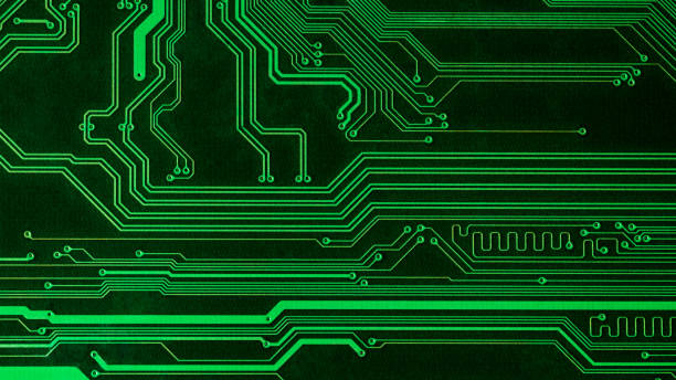 istock Full screen texture of tracks on a green printed circuit board, panoramic 1268690024