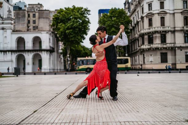 istock Latin couple dancing tango on town square 1268690490