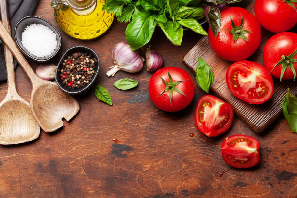 istock Italian cuisine ingredients. Tomatoes, herbs and spices 1268691586