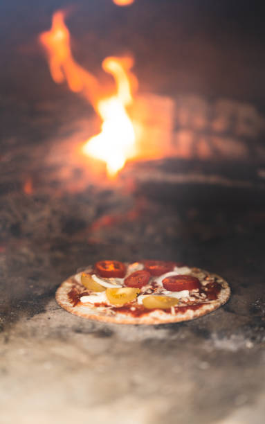 Small gluten-free pizza inside a pizza oven