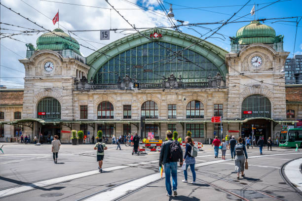 Basel Switzerland , 29 June 2020 : Front view of Basel SBB train station with people going to it in Basel Switzerland