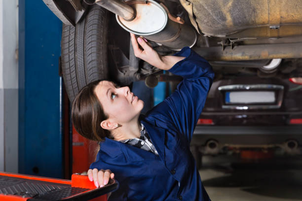 istock Female master is repairing car on her workplace 1268692835