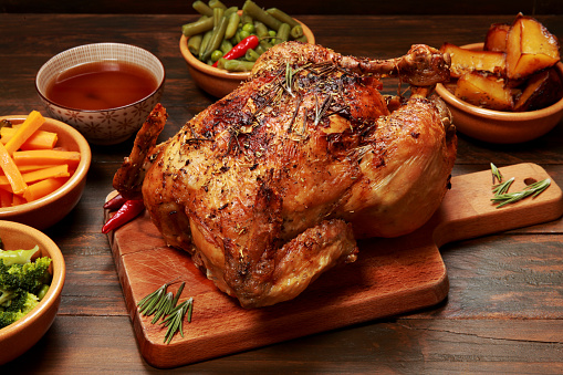 Roast Chicken and Vegetables on a wooden table